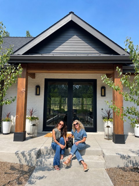 Danielle Gates and Kirsten Milne of MG Estate Management & Concierge on the front steps of a Bend home